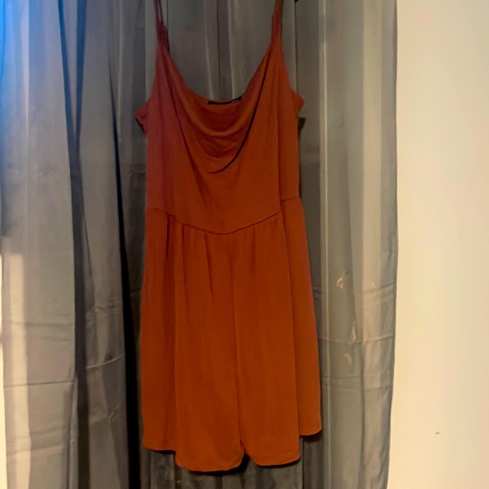 Rust colored short jumper by black tape size large